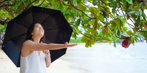 Girl on a beach with umbrella